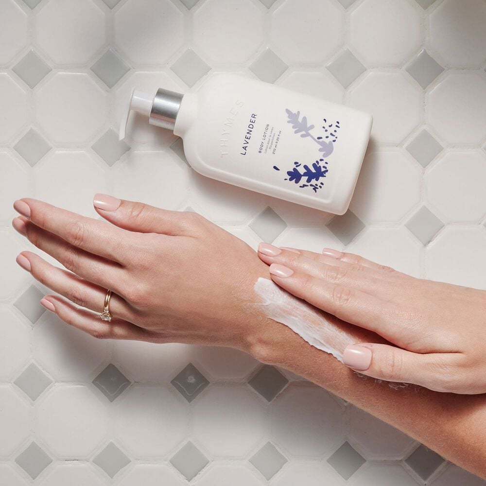 Thymes Lavender Body Lotion applying on hands image number 2